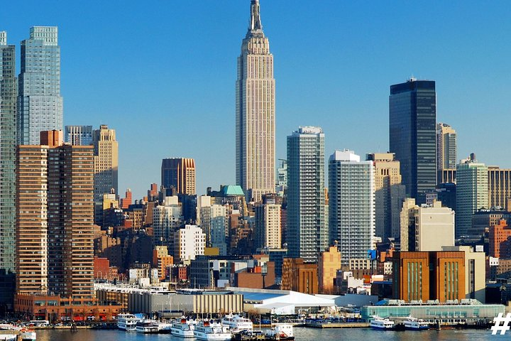 Explore the iconic skyline of New York City featuring landmarks like the Empire State Building while enjoying a guided tour that takes you through the city’s rich history and culture.
